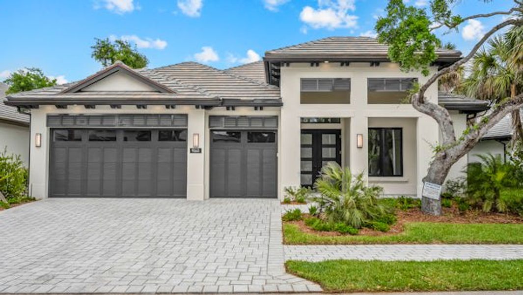 Front exterior of a home in the Seaglass community, located in Vero Beach, FL (Image 63).