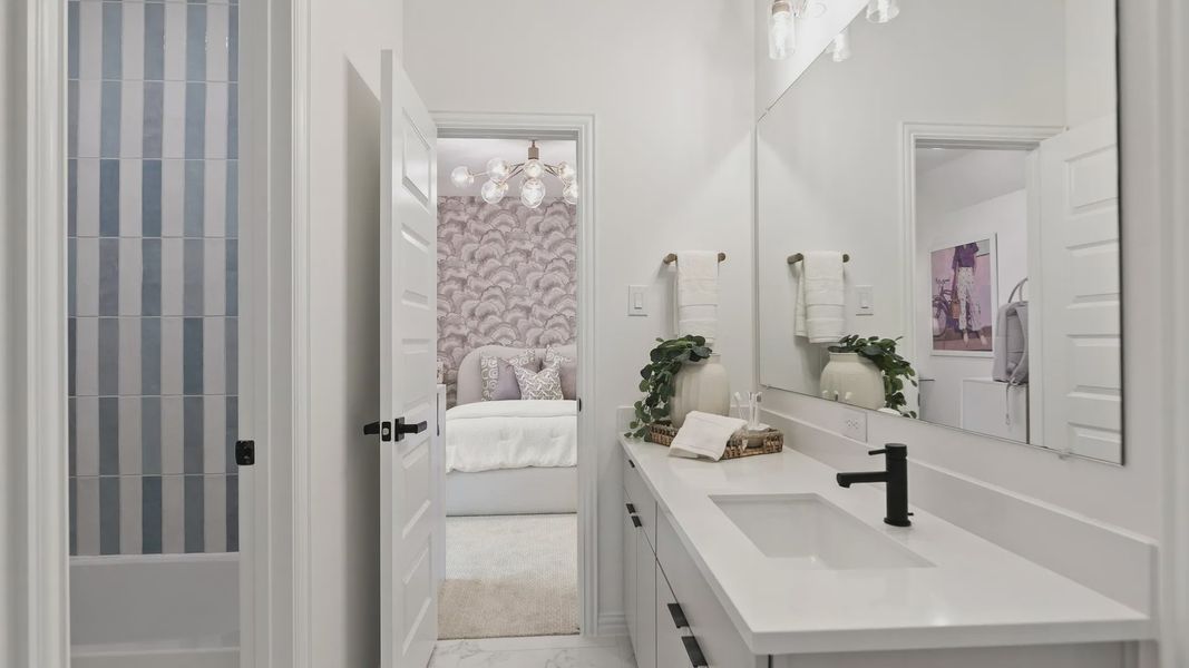 Experience refined luxury with sleek marble flooring and chic black accents in Katy Lakes' contemporary design. Experience refined luxury with sleek marble flooring and chic black accents in Katy Lakes' contemporary design.