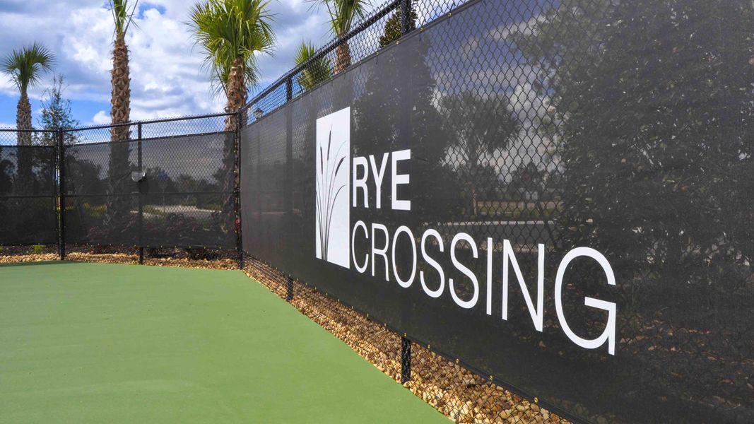 Entrance to the Rye Crossing community in Parrish, FL, featuring signage and landscaping (Image 12).