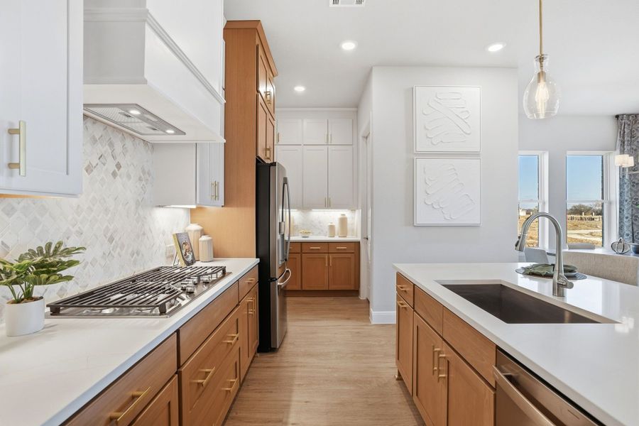 Furnished interior in a model home at Lily Creek at Sutton Fields in Aubrey (Image 100).