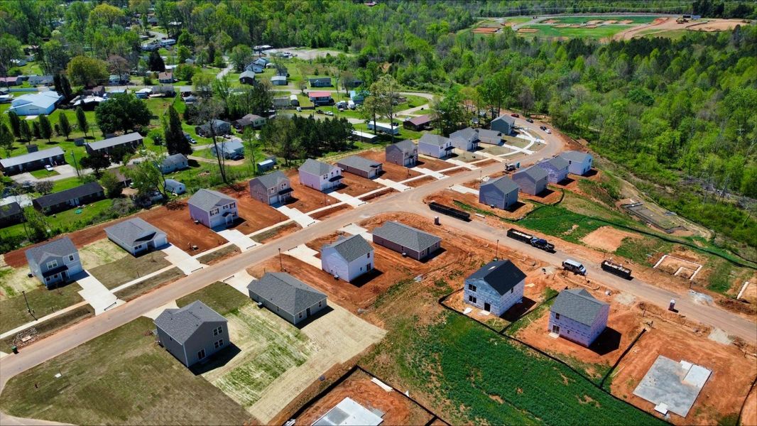 A group of houses in a field.
