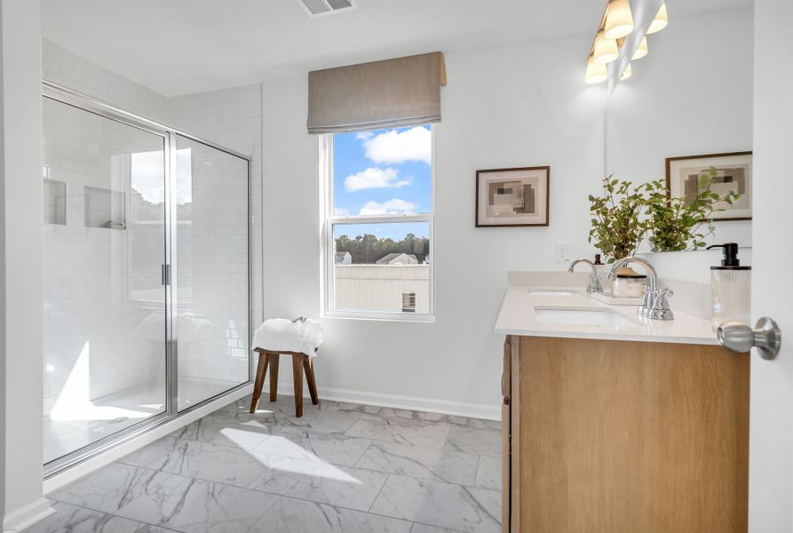 Furnished interior in a model home at Reeves Crossing in St. George (Image 20).