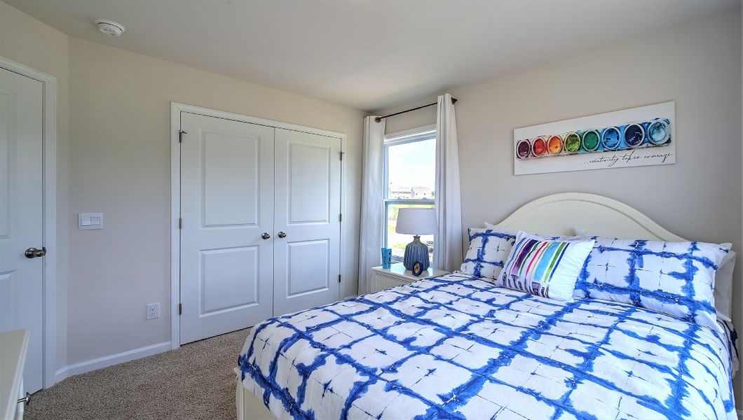 Furnished interior in a model home at Townes at Tap Root Farms in Fletcher (Image 17).