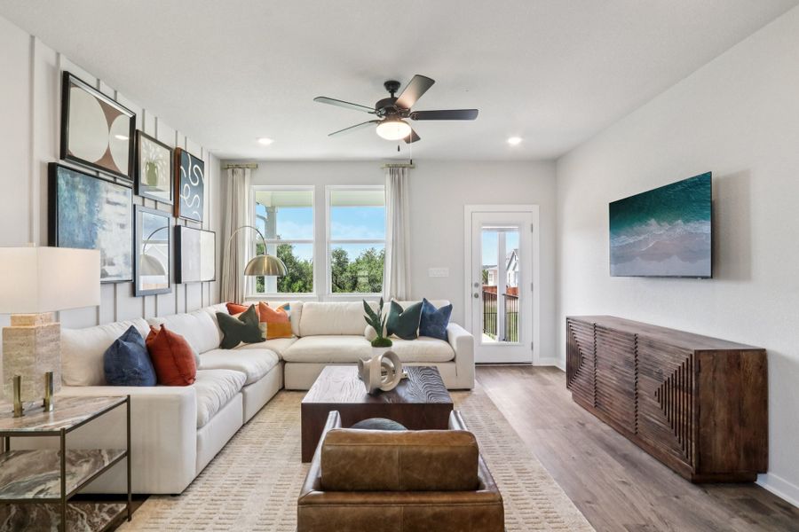 A living room with a wood floor. A living room with a wood floor.