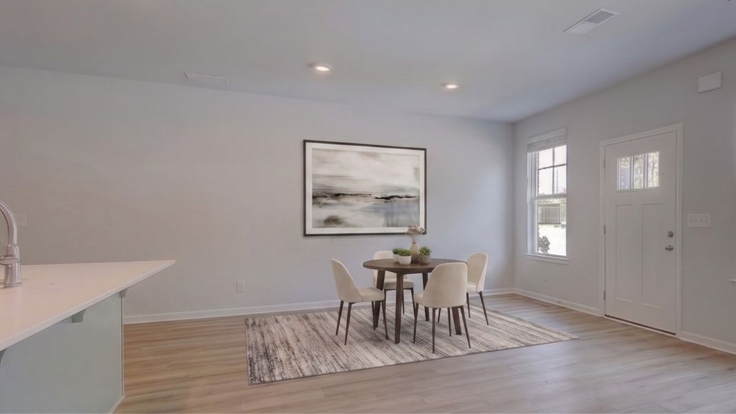Dining area with window and hard surface flooring