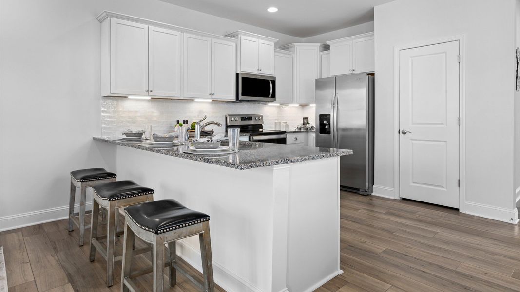 Furnished interior in a model home at Weldon Village Townhomes in Franklinton (Image 4).