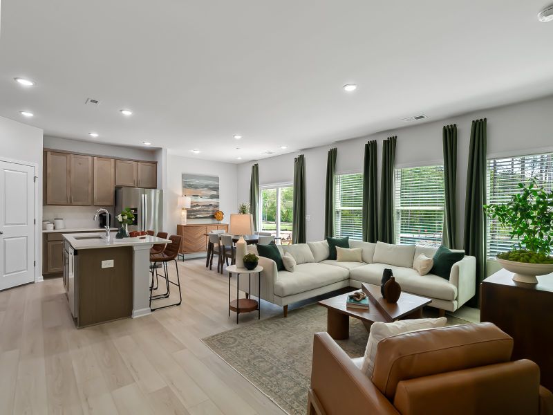 Flooded by natural light, the sprawling great room is perfect for entertaining large gatherings.