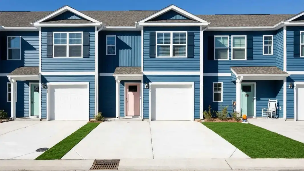 Front exterior of a home in the The Townes at Cedar Hill Landing community, located in Navassa, NC (Image 4).