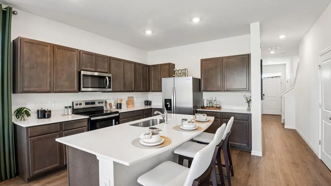 Furnished interior in a model home at Sanctuary at Citrus Park Townhomes in Tampa (Image 6).