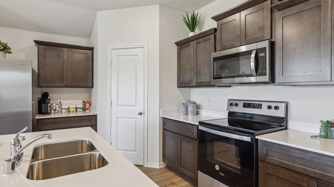 Furnished interior in a model home at Creeks at Burnett Trail in Canton (Image 5).