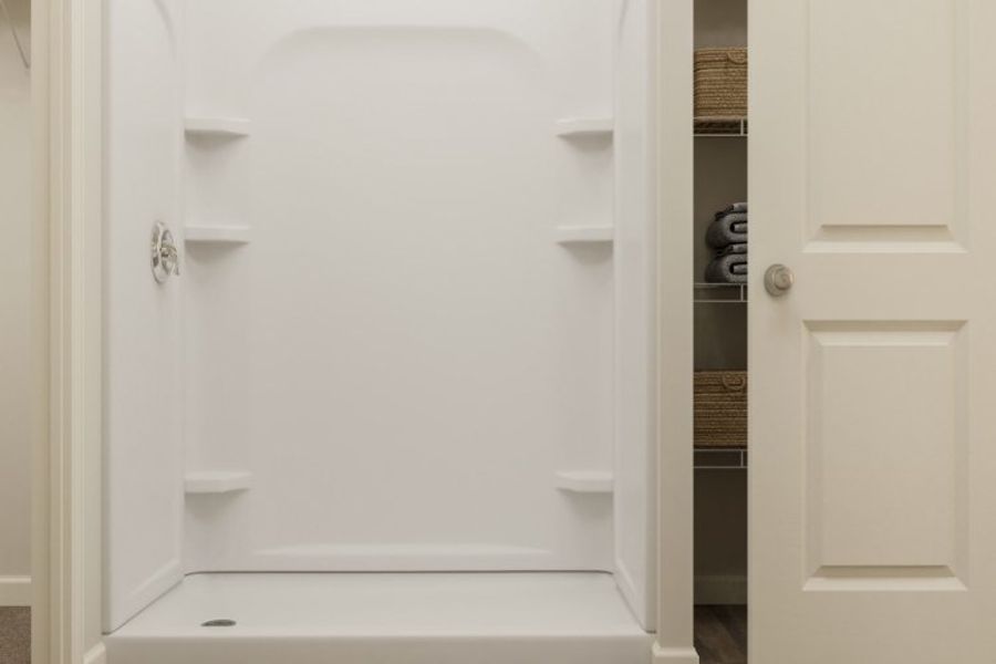 A white bathtub in a bathroom.