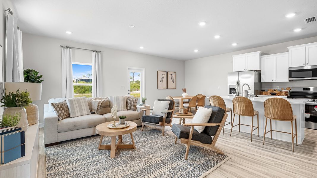 Furnished interior in a model home at WindMark Townhomes in Port Saint Joe (Image 14).
