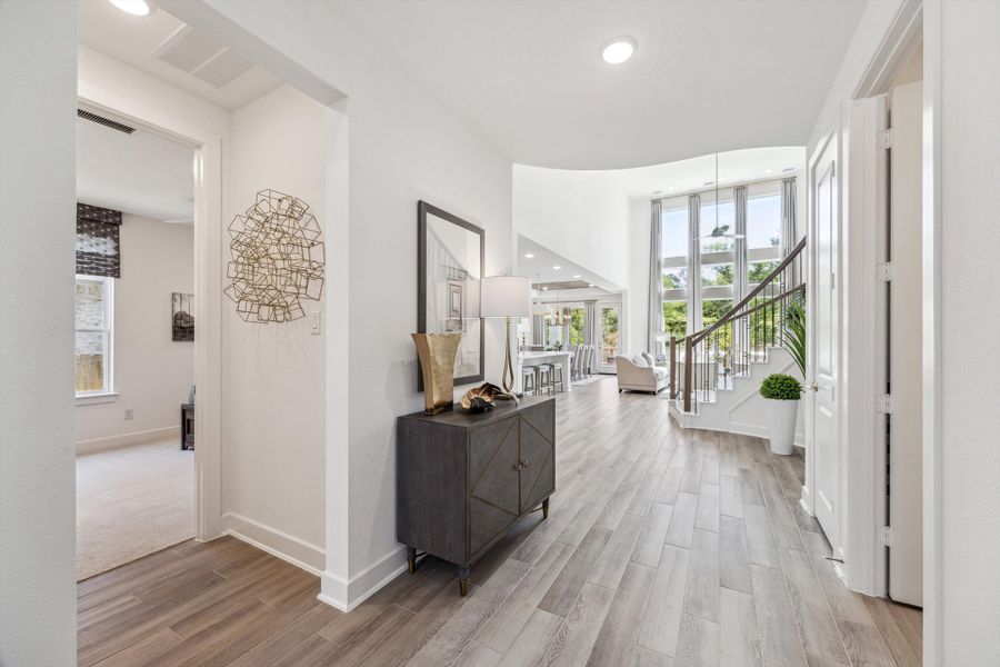 Furnished interior in a model home at The Woodlands Hills – 55' in Willis (Image 3).