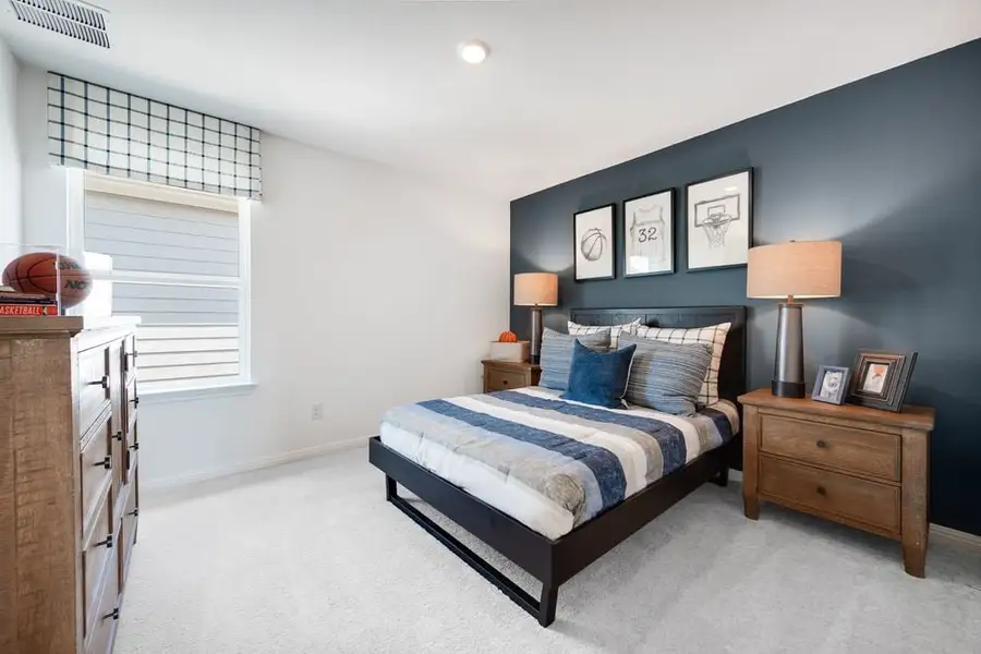 Furnished interior in a model home at Stonewall Ranch 40s in Liberty Hill (Image 40).