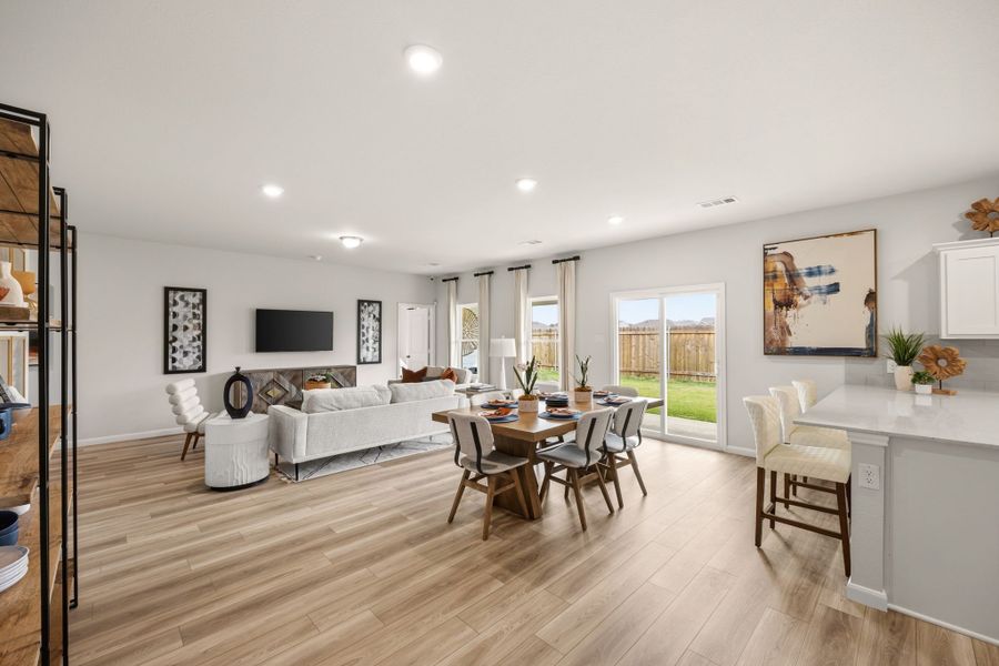 A large living room with a wood floor. A large living room with a wood floor.