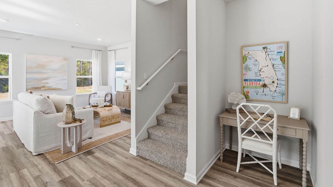 Furnished interior in a model home at Chateau Nemours in Port Saint Joe (Image 9).