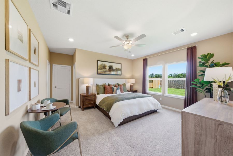 A bedroom with a large window. A bedroom with a large window.