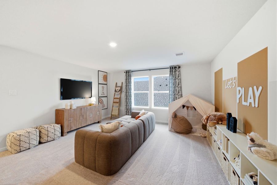 A living room with a tv and furniture. A living room with a tv and furniture.