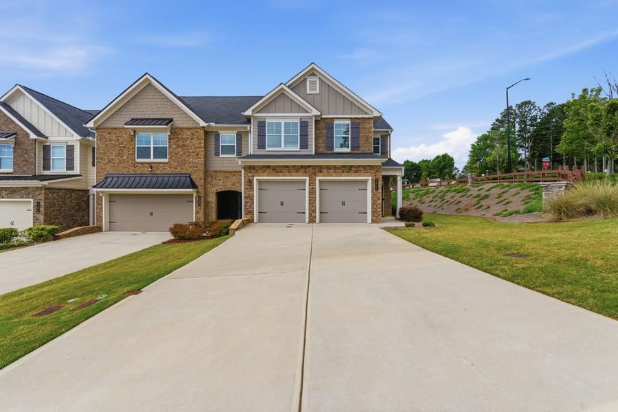 Front exterior of a home in the Park Center Pointe community, located in Austell, GA (Image 13). Front exterior of a home in the Park Center Pointe community, located in Austell, GA (Image 13).