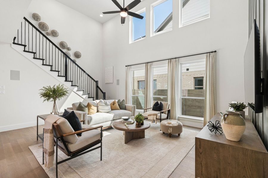 Open Living Room with Modern Staircase in Ramble Model Open Living Room with Modern Staircase in Ramble Model