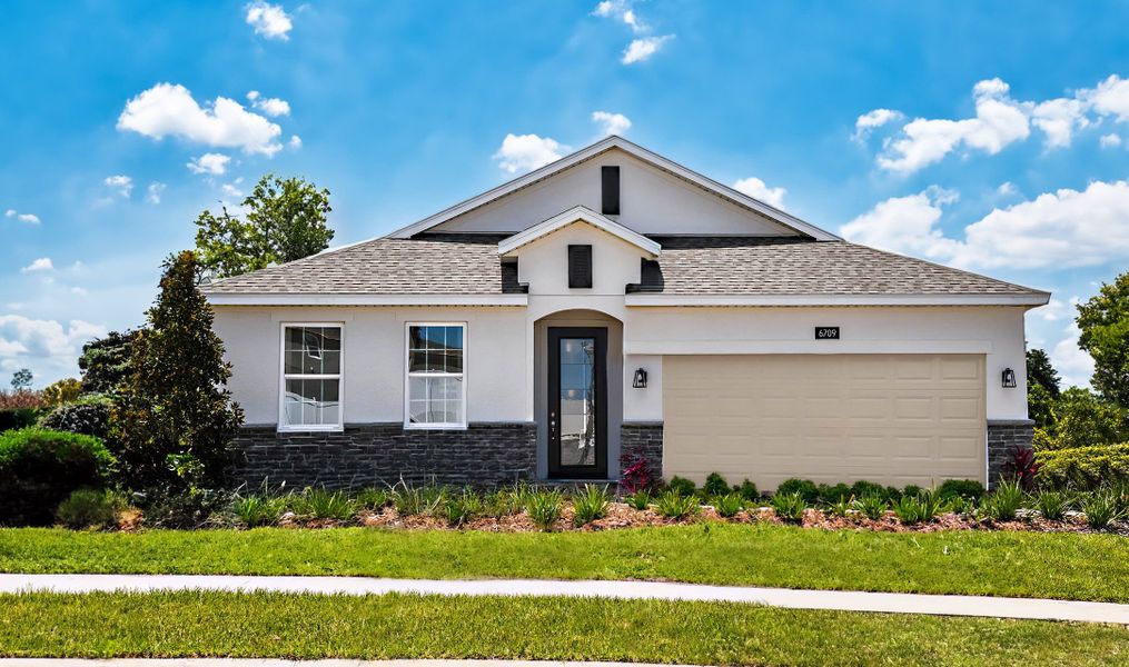 Front exterior of a home in the Eagletail Landings community, located in Howey-in-the-Hills, FL (Image 2).