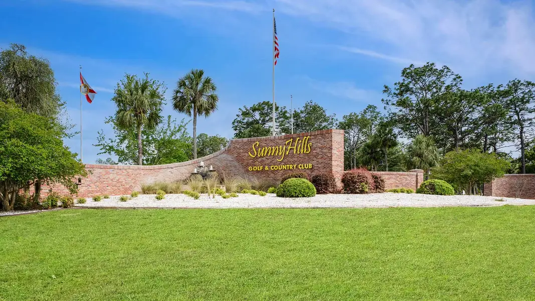 Entrance to the Sunny Hills community in Chipley, FL, featuring signage and landscaping (Image 1).