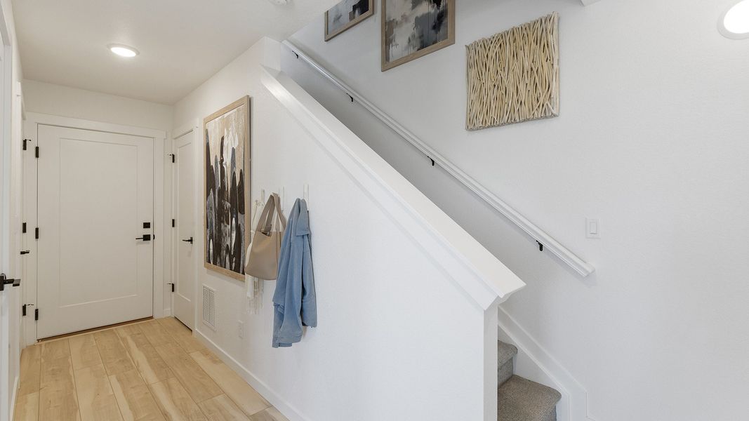 Experience the luxury of elegant design in this modern single-family home entryway.