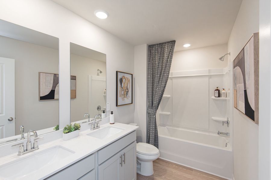 Host guests comfortably with a complementary secondary bathroom on the upper level.