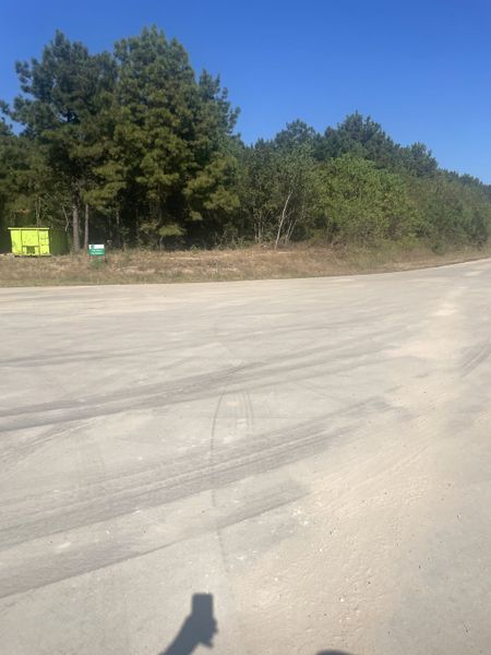 A spacious lot surrounded by lush greenery in Tealpointe Lake Estates by Jamestown Estate Homes (Tomball, TX).