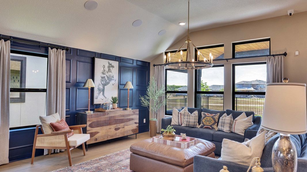 Revel in the opulence of a navy paneled accent wall, rich textures, and expansive windows in Lakeside Meadows. Revel in the opulence of a navy paneled accent wall, rich textures, and expansive windows in Lakeside Meadows.
