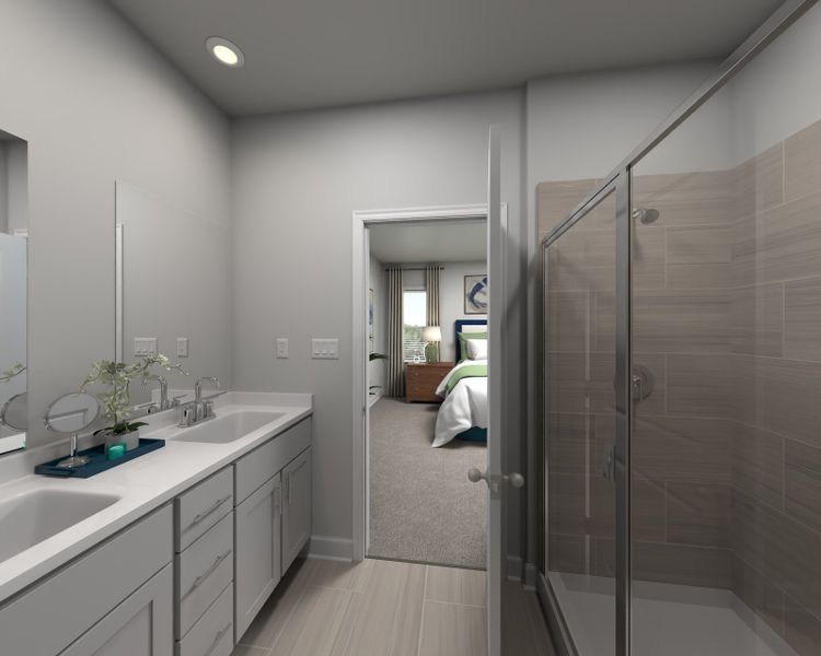 The primary bathroom offers dual vanity sinks and a walk-in shower.