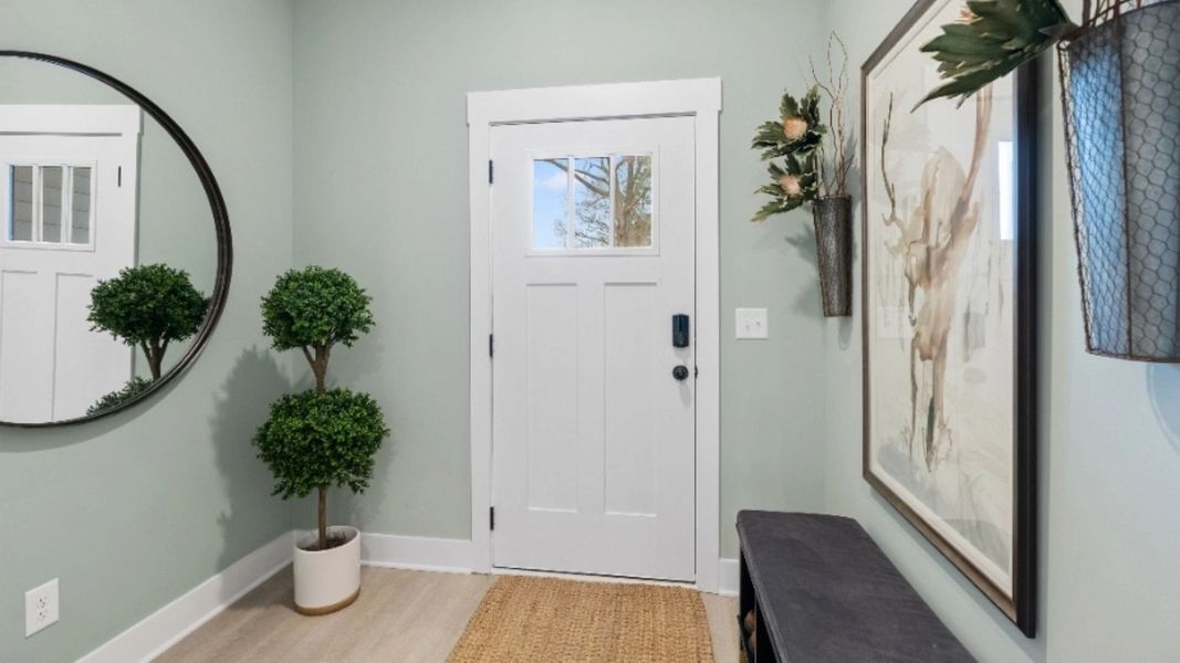 Litchfield design inviting entrance with wide-entry hallway and premium finishes. Leigh Park by DRB Homes. Charlotte, NC.