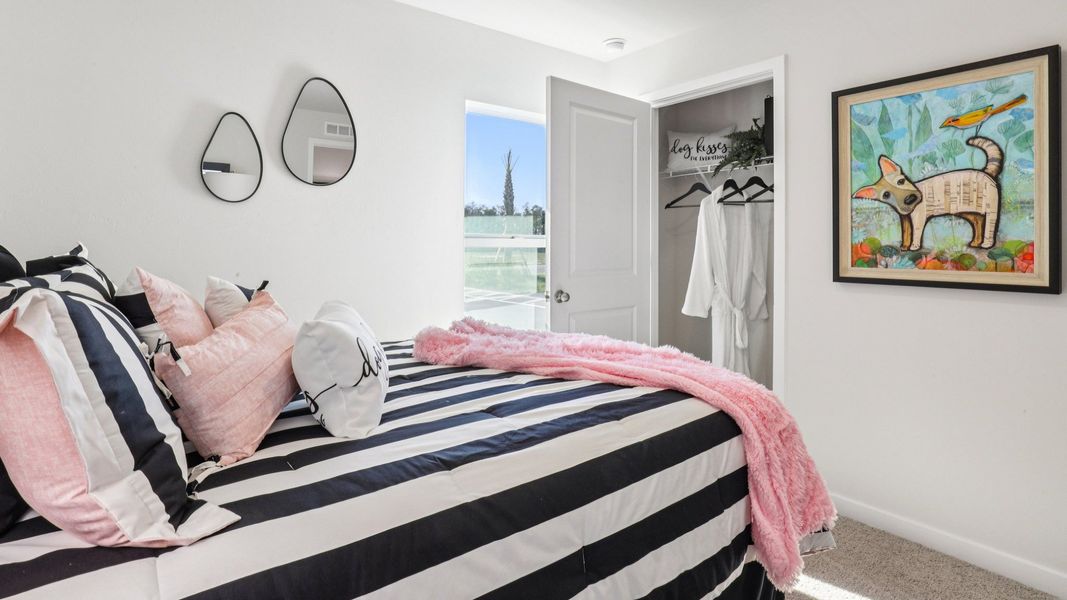 Furnished interior in a model home at Asher Park in Lehigh Acres (Image 27).