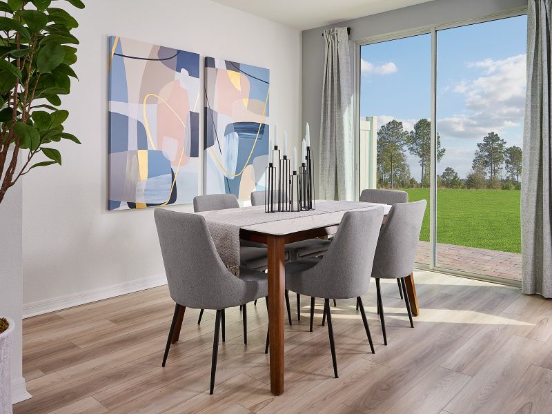 Dining room in Oakville floorplan at The Meadow at Crossprairie