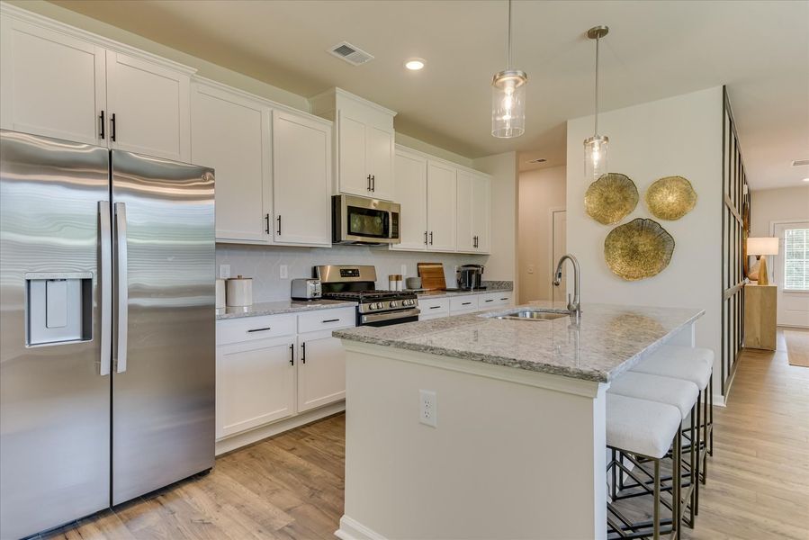 Enjoy designer-inspired kitchens with large center islands Enjoy designer-inspired kitchens with large center islands