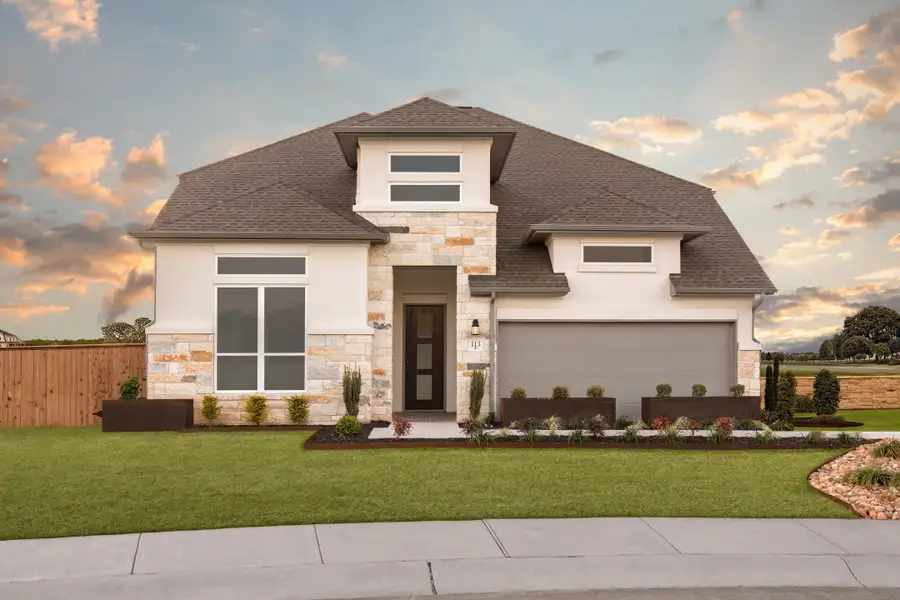 Front exterior of a home in the Parmer Ranch community, located in Georgetown, TX (Image 6).