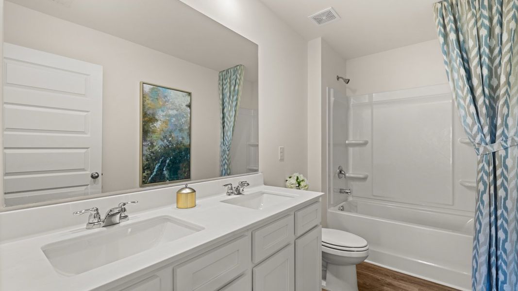 Furnished interior in a model home at Shoal Creek in Hampton (Image 34).