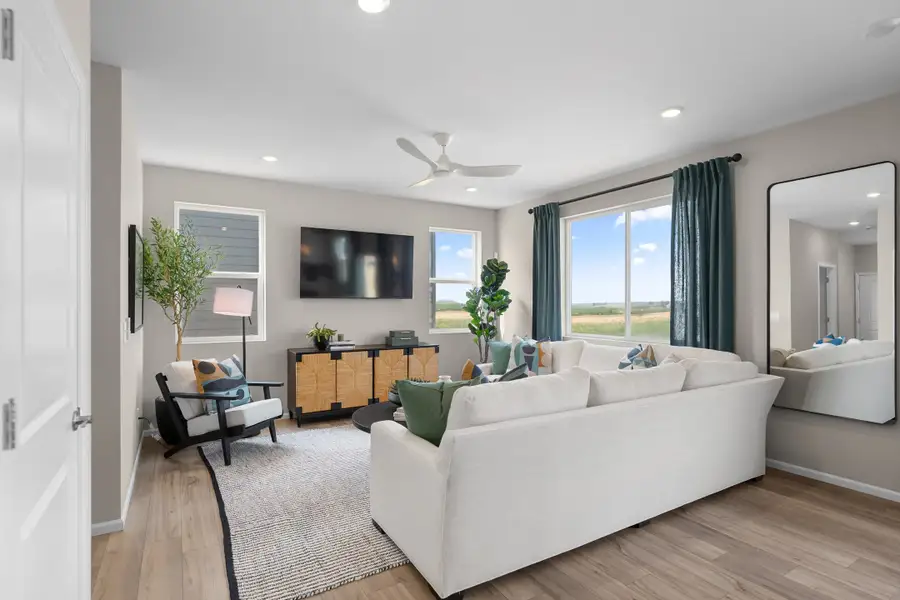 Furnished interior in a model home at The Cottages Collection at Mead Crossing in Mead (Image 3).
