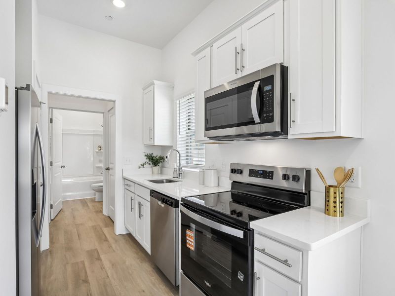 Furnished interior in a model home at Preston Park in Spring Hill (Image 5).