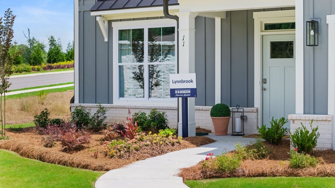 Front exterior of a home in the Hamptons at Riverwood East community, located in Dallas, GA (Image 6).
