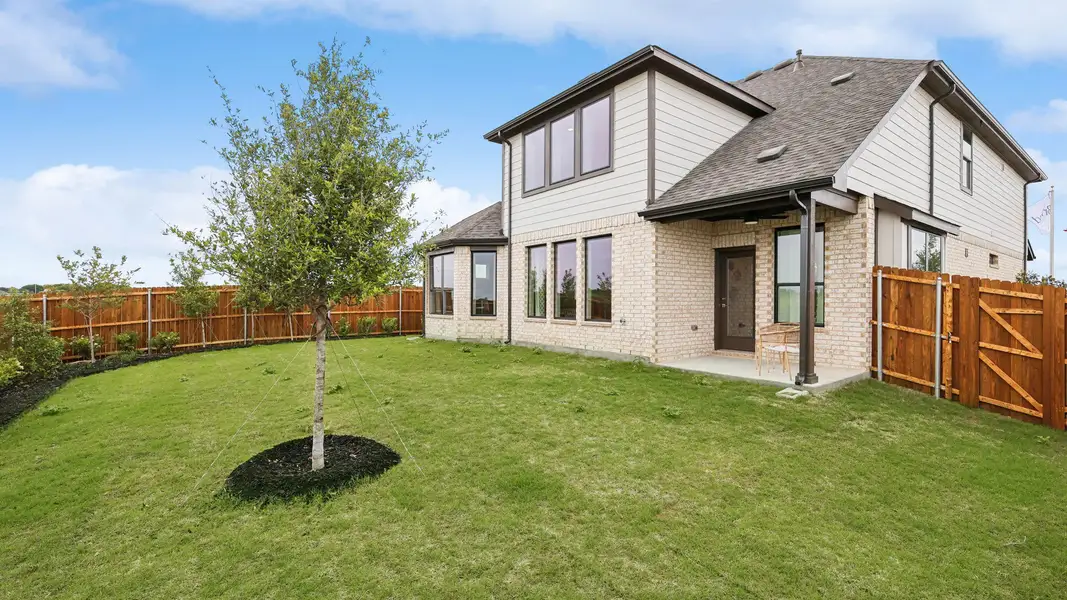 Elegant two-story brick residence with expansive windows and lush lawn in Hulen Trails. Elegant two-story brick residence with expansive windows and lush lawn in Hulen Trails.