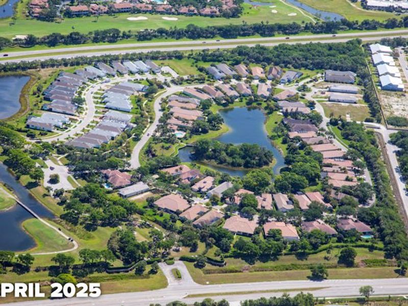 Aerial view of the The Falls at Grand Harbor community in Vero Beach, FL, showing layout and nearby surroundings (Image 10).