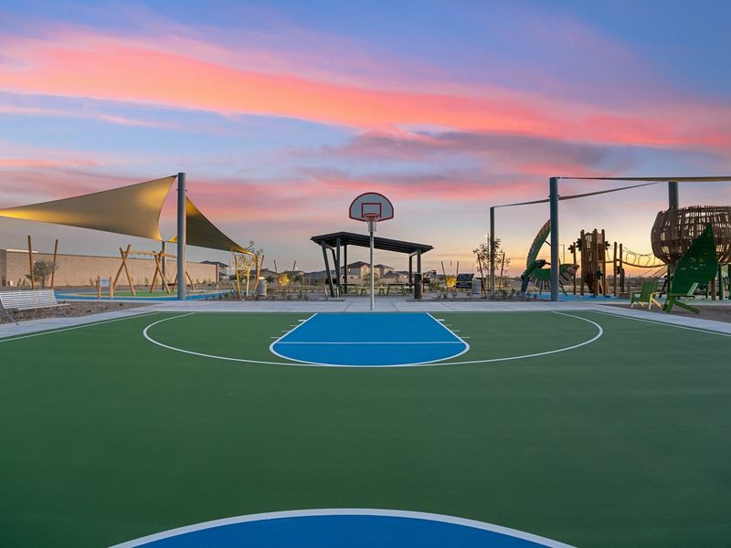 A basketball court with a basketball hoop. A basketball court with a basketball hoop.