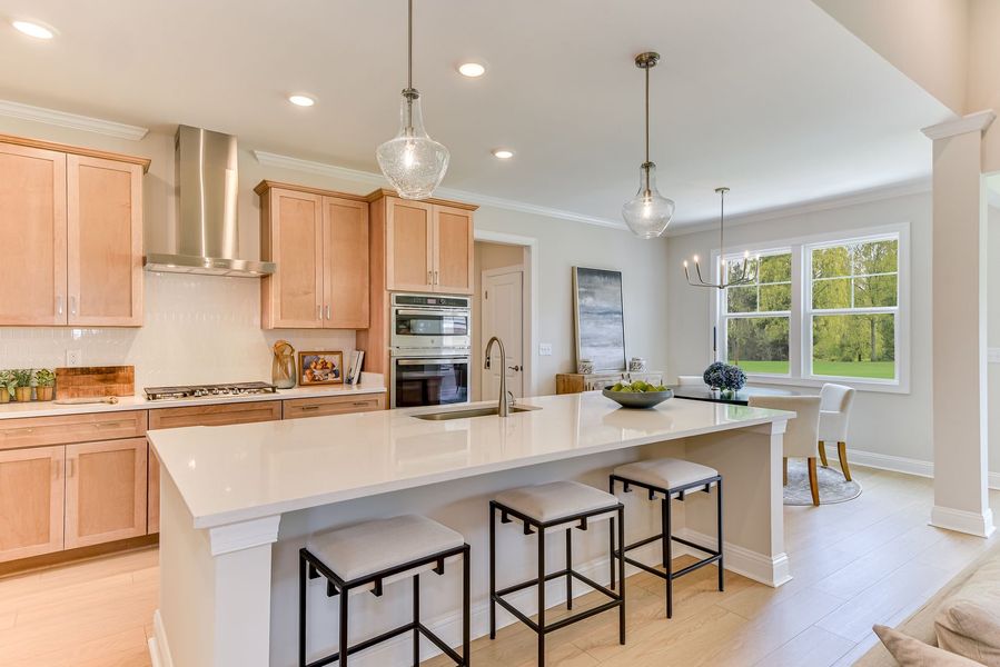 Well-appointed kitchens featuring large islands that support cooking, gathering, and everyday routine Well-appointed kitchens featuring large islands that support cooking, gathering, and everyday routine