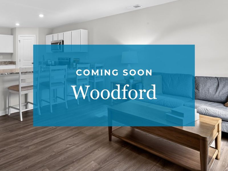 A room with a couch and a table.