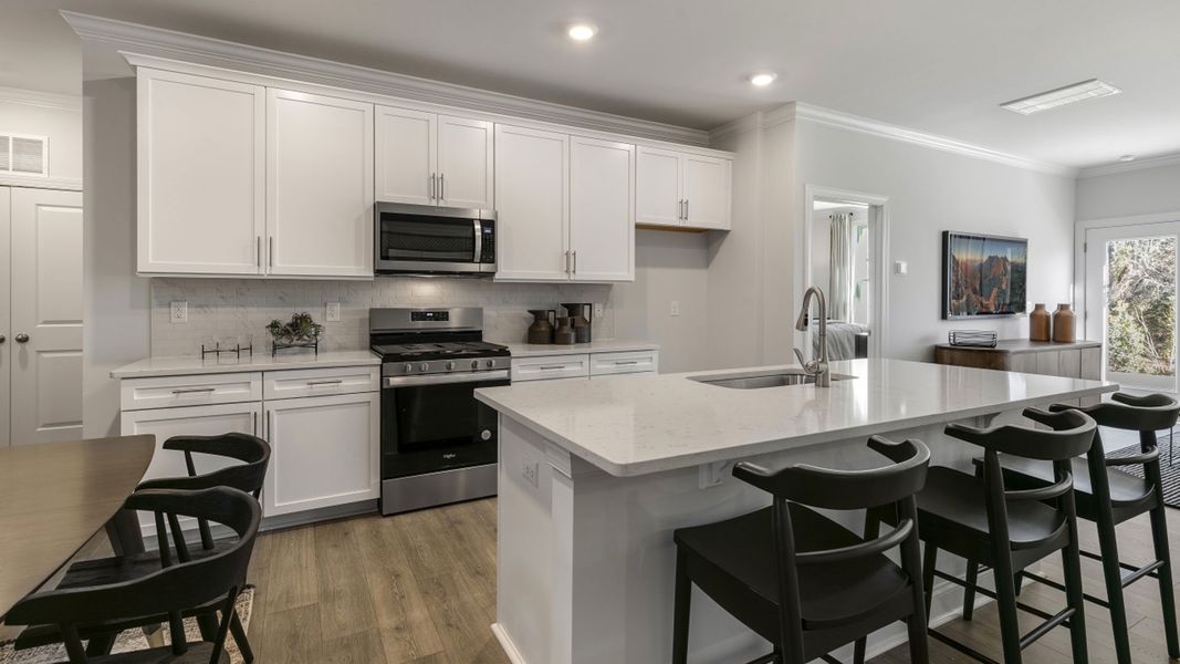 Furnished interior in a model home at The Meadows at Kinsley in Jamestown (Image 10).