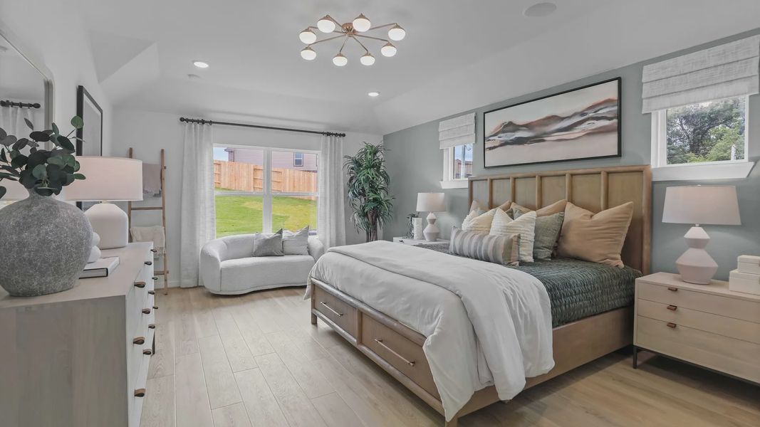 Expansive bedroom boasts hardwood floors, chic lighting, and serene views in Mostyn Springs. Expansive bedroom boasts hardwood floors, chic lighting, and serene views in Mostyn Springs.