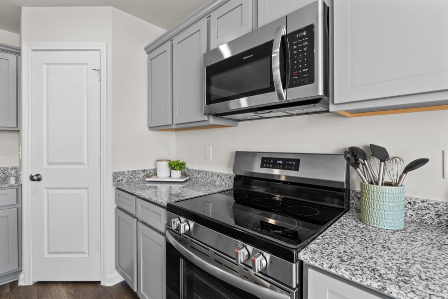 Furnished interior in a model home at Canary Woods in Hopkins (Image 10).