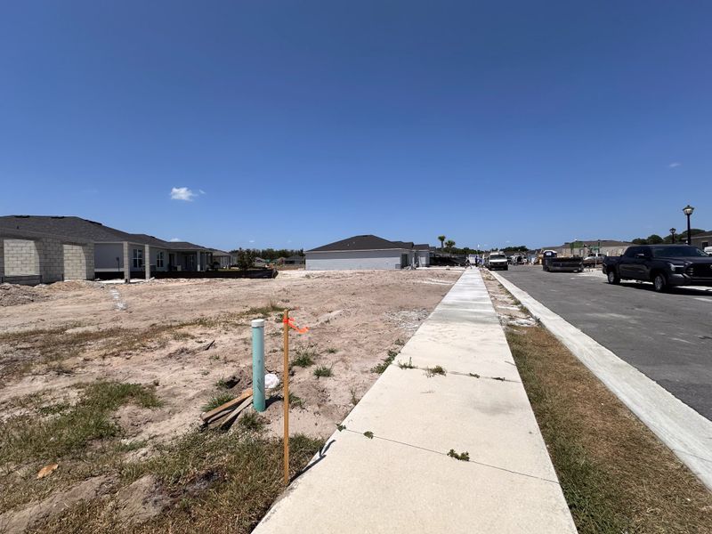 A developing neighborhood with newly built homes in Spirit Landings by KB Home (Winter Haven, FL).