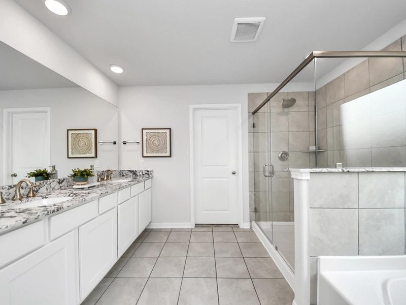 Furnished interior in a model home at Sunterra in Katy (Image 25).